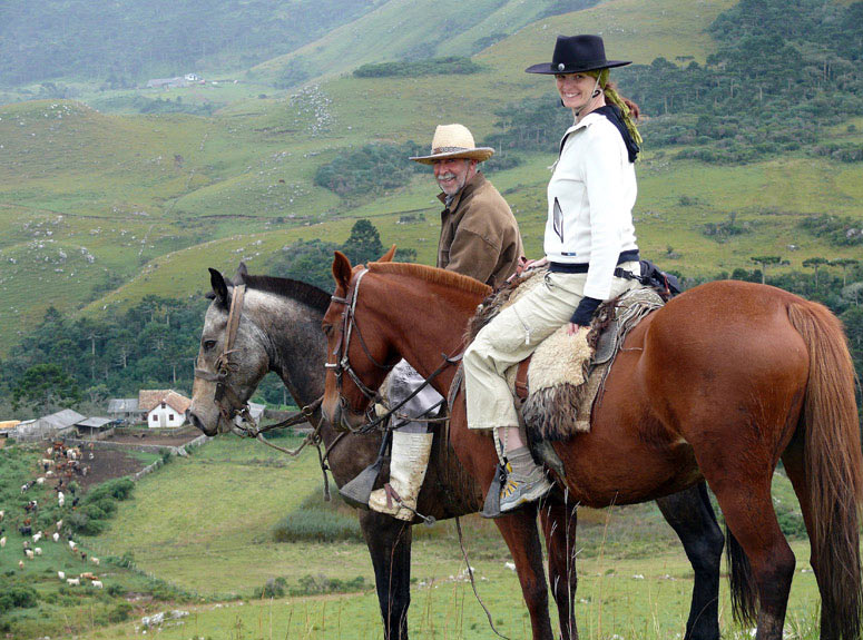 Billie Grether driving the cattle with Elvio